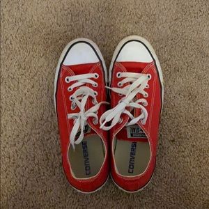 lightly used red and white converse